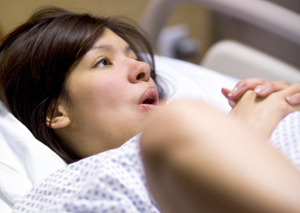 A woman giving birth calmly